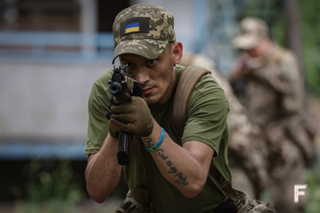 frontliner - former crime prisoner with AK gun on the army training